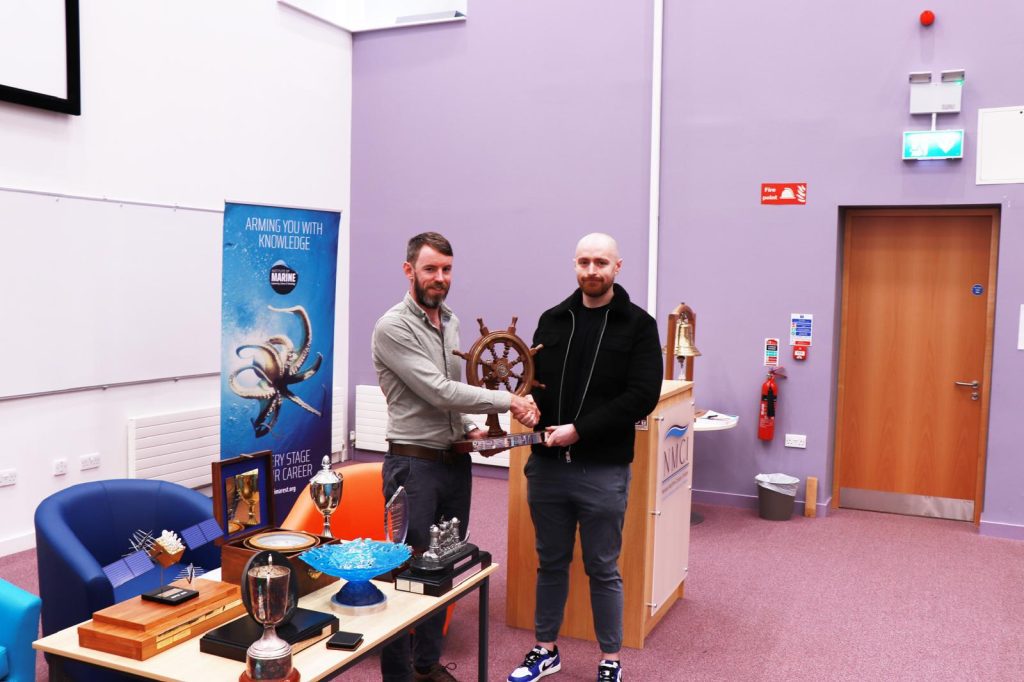 Deck Cadet Michael Moloney receiving the Don Curtis Award from National Officer of the Irish Institute of Master Mariners, and Nautical Studies Lecturer Dónal Keane.